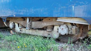 Voiture UIC couchettes A4c4B5c5x : gros plan sur un bogie Y24
